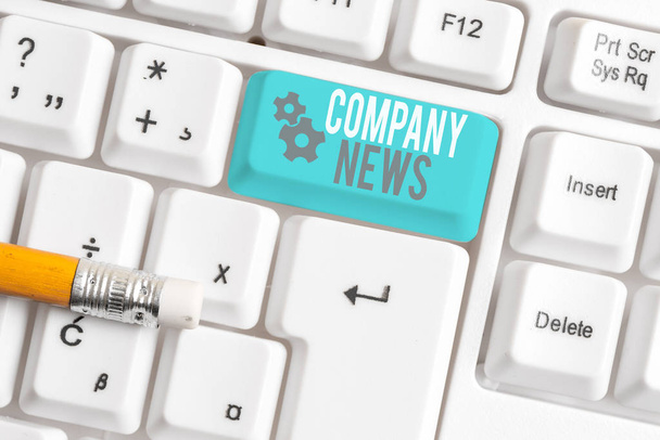 Writing note showing Company News. Business photo showcasing Latest Information and happening on a business Corporate Report White pc keyboard with note paper above the white background. - Photo, Image