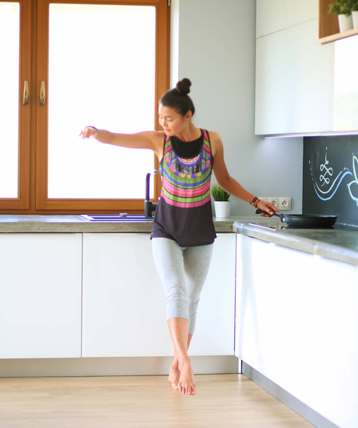 Fit and attractive young woman preparing healthy meal. Woman. - 写真・画像