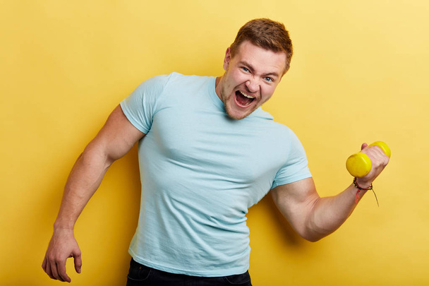 funny crazy man gets pleasure from workout, man preparing for a contest, - Photo, image