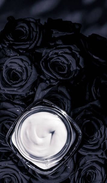 Face cream skin moisturizer and black roses flowers, luxury skin - Photo, Image