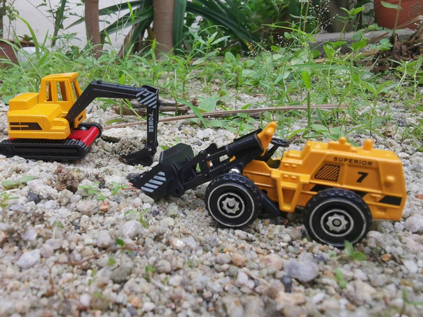 excavators toys machinery on garden ground - Photo, Image