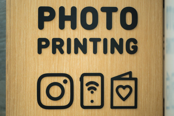 Close-up view of the photo printing sign - Photo, Image