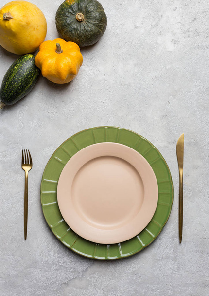 Empty plate with fork and knife and pumpkins - Φωτογραφία, εικόνα