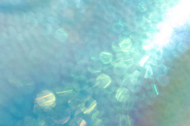 Abstracte glanzende iriserende Turquoise achtergrond met holografische  - Foto, afbeelding