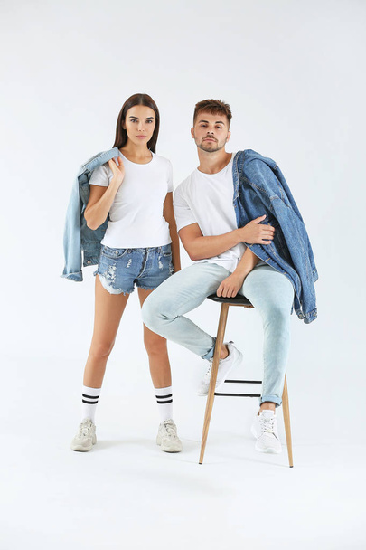 Fashionable young couple on white background - Photo, Image