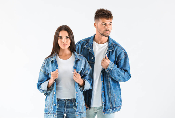 Fashionable young couple on white background - Foto, imagen