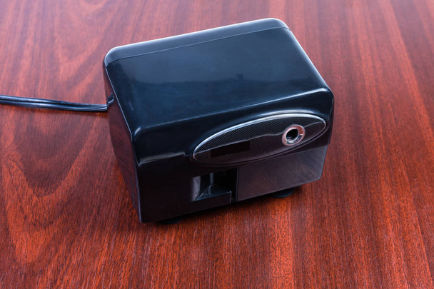 Desk electric pencil sharpener on the wooden table - Photo, Image