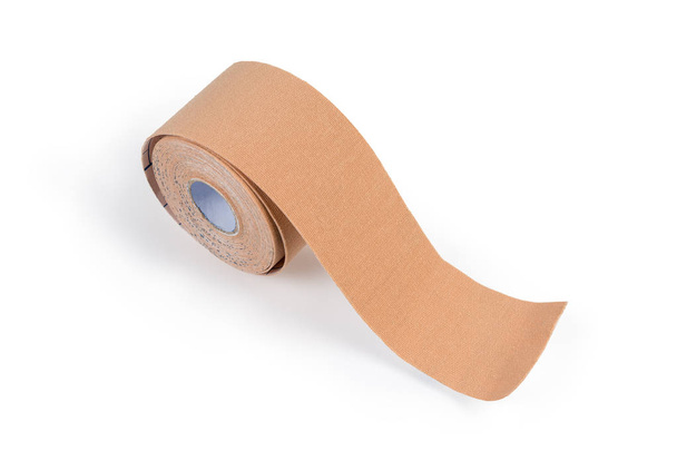 Flesh-colored elastic therapeutic tape on a light background - Photo, Image