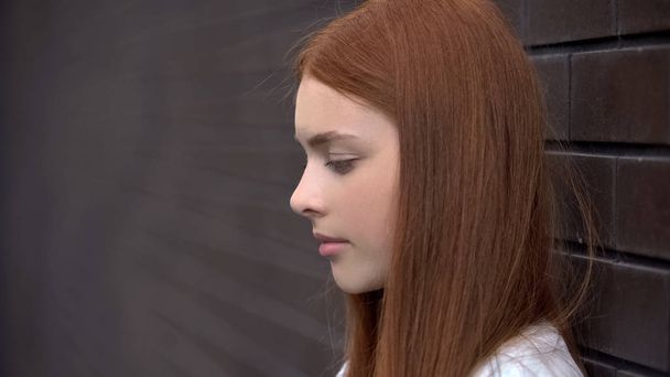 Upset red-haired young woman, frustrated female teenager, melancholy sadness - Foto, Bild