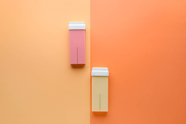 Liposoluble wax cartridges on color background - Фото, зображення