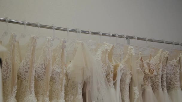 Beautiful wedding dresses in a bridal salon. - Footage, Video