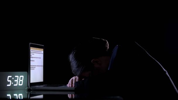 Exhausted female in formalwear lying on laptop at night in office, overworking - Zdjęcie, obraz