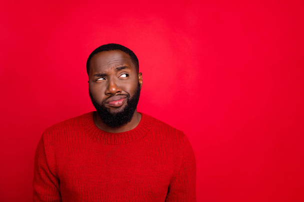 Close-up portrait of his he nice attractive skeptic doubtful bearded guy boyfriend creating plan guessing clue isolated over bright vivid shine red background - 写真・画像