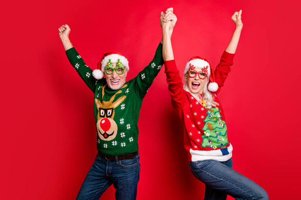 2020 is here x-mas newyear.Dream come true at midnight.Two cheerful positive comic grey white haired in cap headwear people having luck good mood raising hands up isolated bright color background - Photo, image