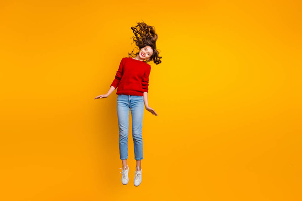 Full size photo of cute lady jumping high wear knitted sweater isolated yellow background - Φωτογραφία, εικόνα