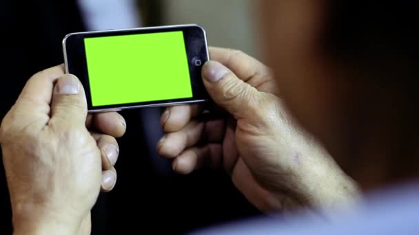 Szúró telefon-val zöld képernyő. Nagyítás/kicsinyítés. - Felvétel, videó