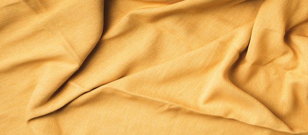 Yellow fabric texture background. Top View of cloth textile surface. Abstract backdrop for design - Foto, imagen