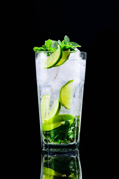 classic mojito cocktail with reflection on a dark background - Photo, Image