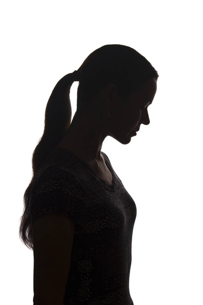 Silhouette of a young woman with problems - Fotó, kép