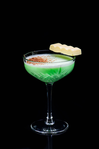 classic grasshopper cocktail with reflection on a dark background - Fotó, kép