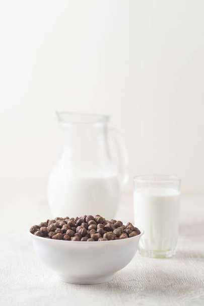 Breakfast: chocolate balls, fresh cows milk, selective focus - Zdjęcie, obraz