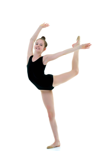The gymnast perform an acrobatic element. - Фото, зображення
