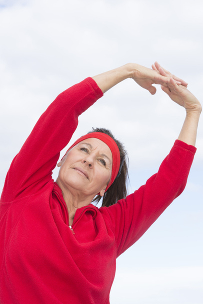 Senior woman stretching exercise outdoor - Foto, Imagen