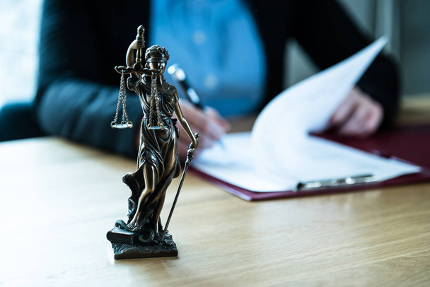 Judge working at table with symbols of law and justice - Fotoğraf, Görsel