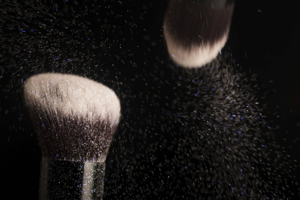 Cosmetics brush and colorful makeup powder - Foto, imagen