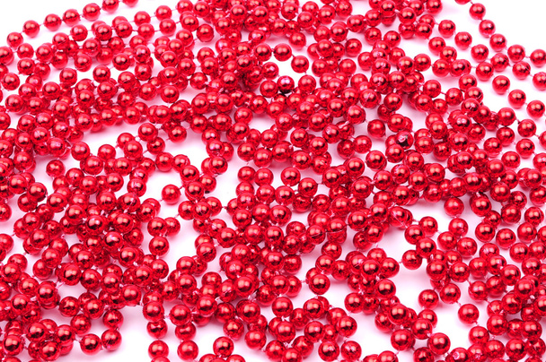 Red beads, Christmas decoration, isolated on white background - Photo, Image