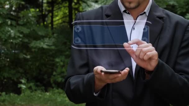 Businessman uses hologram with text Commission - Footage, Video