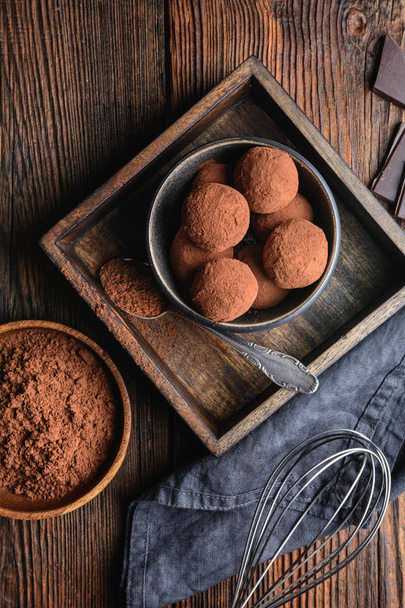 Delicious treat, homemade chocolate truffle covered in cocoa powder - Фото, изображение