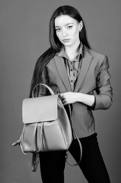 Woman with leather knapsack. Stylish woman in jacket with leather backpack. Formal style accessories. Backpack for daily modern urban life. Girl student in formal clothes. Backpack fashion trend - Foto, Imagem
