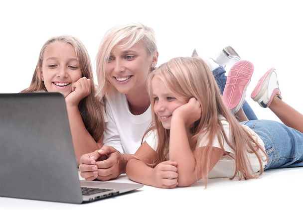 mom and daughters watching their favorite video on a laptop - Φωτογραφία, εικόνα