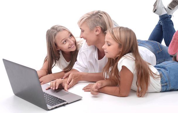 close up. mom and daughters watching a movie on a laptop - Photo, image