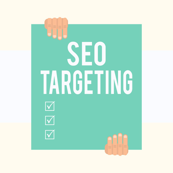 Writing note showing Seo Targeting. Business photo showcasing Specific Keywords for Location Landing Page Top Domain Two hands holding big blank rectangle up down Geometrical background. - Photo, Image