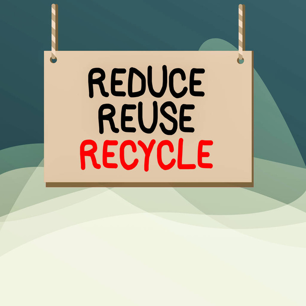 Az újrahasználat újrahasznosításának csökkentése című írásos jegyzet. Üzleti fotó bemutató környezetvédelmi felelőtlen fogyasztói magatartás fa deszka fa üres keret rögzített színes csíkos string. - Fotó, kép