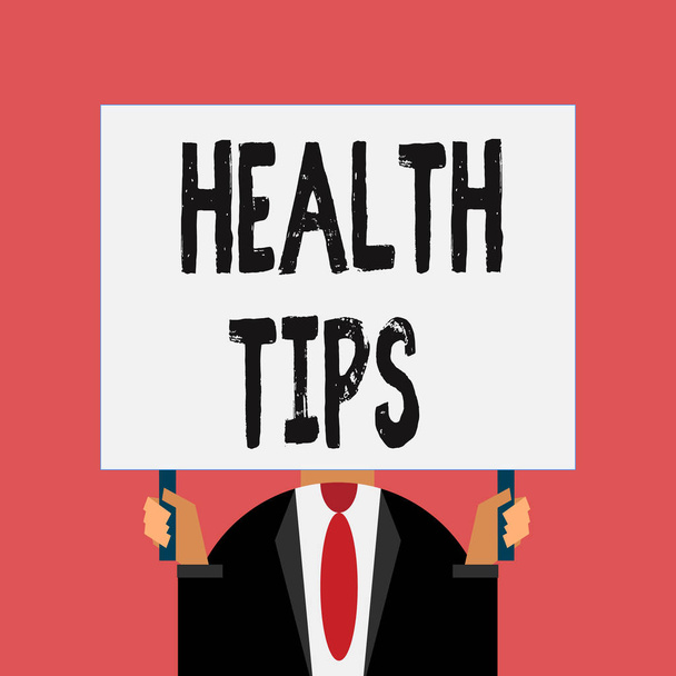 Word writing text Health Tips. Business concept for advice or information given to be helpful in being healthy Just man chest dressed dark suit tie no face holding blank big rectangle. - 写真・画像