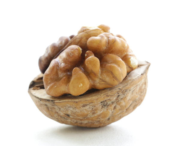 Macro shot walnuts on white background - Фото, изображение