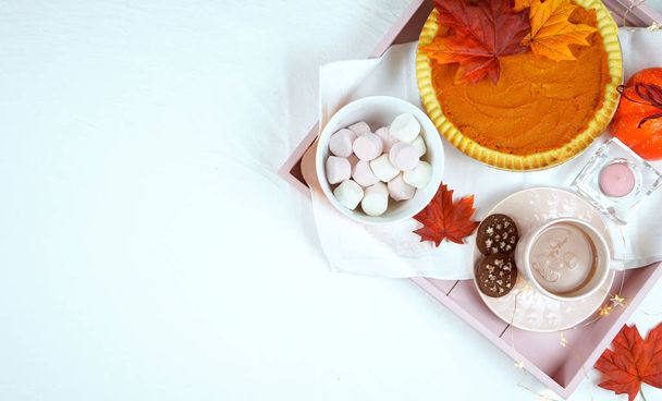 Cozy Thanksgiving flatlay overhead with pumpkin pie and hot chocolate. - Photo, Image