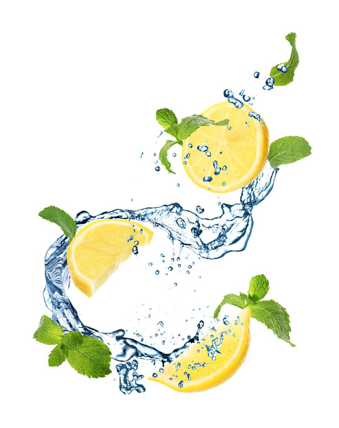 Juicy lemon, mint and splashing water on white background - Photo, image