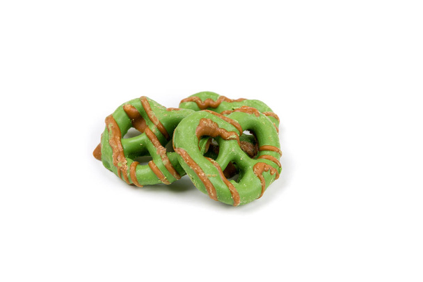 Brown and green caramel apple pretzel treats - 写真・画像