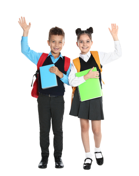 Bambini felici in uniforme scolastica su sfondo bianco
 - Foto, immagini