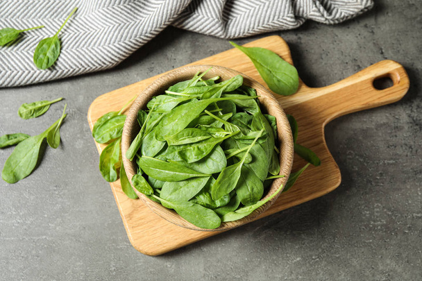 Fresh green healthy spinach on grey table, flat lay - Fotó, kép