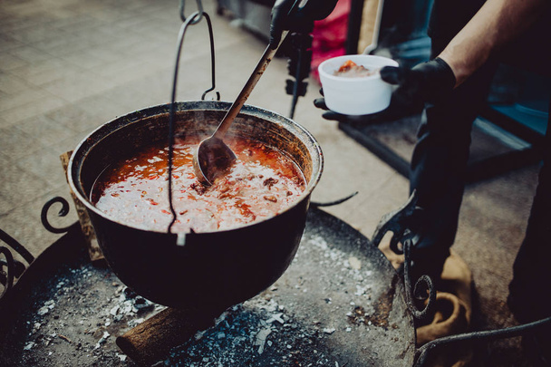 Street food festival, large soup pot from seafood  - Foto, Imagen