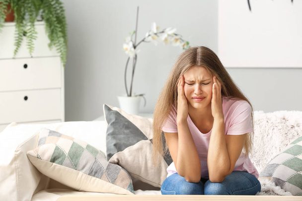 Stressed young woman at home - Photo, Image
