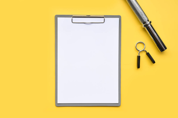 empty paper and accessory on yellow background - Photo, Image