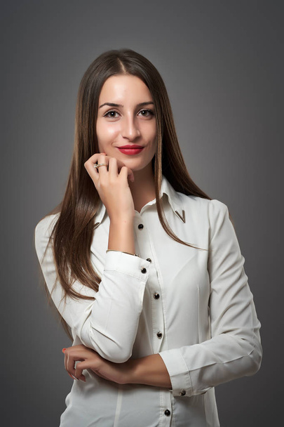 Studio shot of a Latino businesswoman on gray background - Fotó, kép