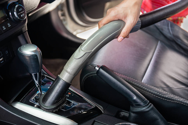 Cleaning modern car interior with vacuum cleaner. Handle vacuum - Photo, Image