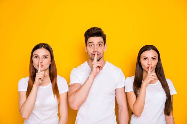 Portrait of three nice attractive lovely winsome person showing shh sign secrecy privacy isolated over bright vivid shine yellow background - Fotoğraf, Görsel
